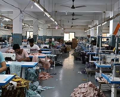 garment factory with workers sewing clothes garment factory with workers sewing clothes